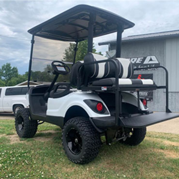 Side view of a gray truck with big wheels